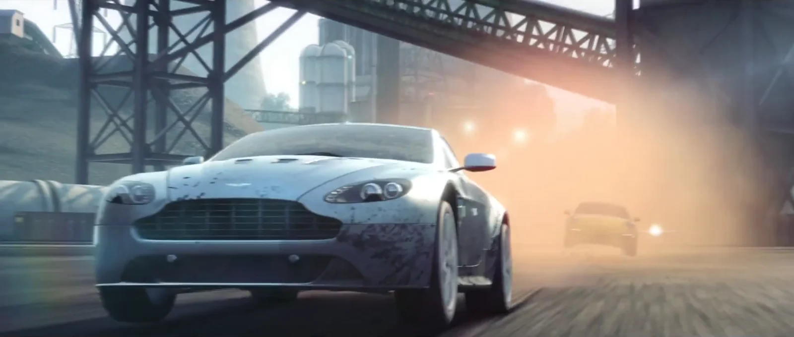 Aston Martin racing through an industrial city in Need for Speed Most Wanted